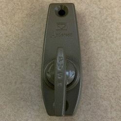 View of Andersen patio door latch lever with logo and thumb‑turn lock that says "push"