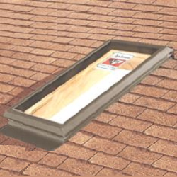 Rectangular skylight installed on a shingled roof, featuring a raised frame and glass pane with a visible Andersen Windows label.