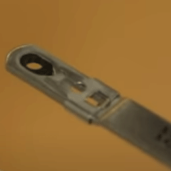 Close-up of a metal hinge arm with an elongated slot where the black hinge insert is located.